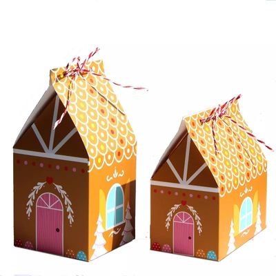A casa dá forma a caixas de presente do Natal para o cartão descartável dos doces