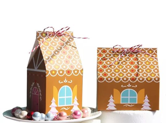 A casa dá forma a caixas de presente do Natal para o cartão descartável dos doces